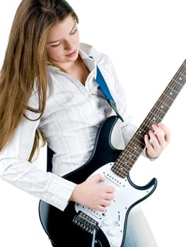 Teen girl holding a guitar like a rock star
