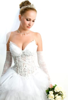 Beautiful bride portrait with flowers in her hand