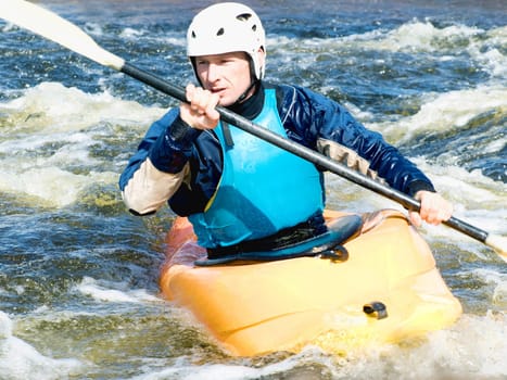 a shot of the kayaker on the rough water