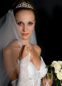 Beautiful bride portrait with flowers in her hand