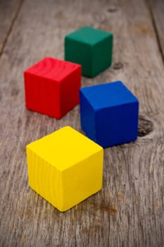 Wooden colored cubes on the old floor