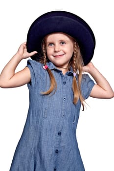 little girl in blue dress wearing the big black hat
