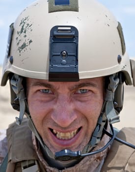 Scary face of US marine in the MARPAT uniform showing teeth