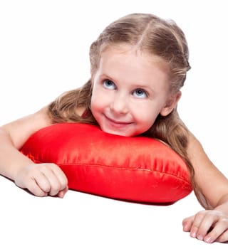 pretty little girl lying on the red pillow