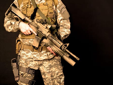 US soldier holding his assault rifle