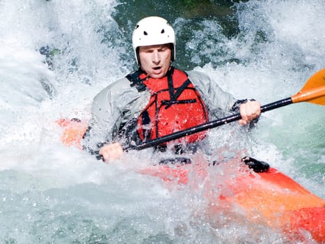 an active kayaker on the rough water