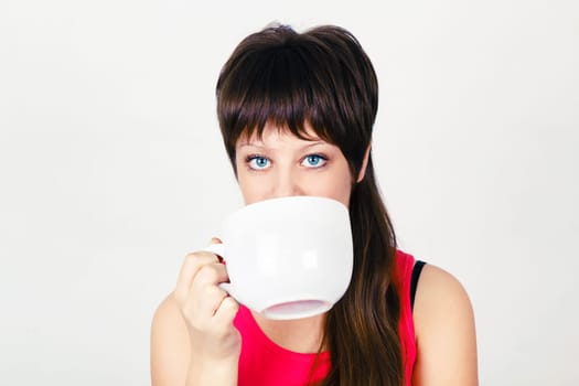 Young attractive girl with a huge mug
