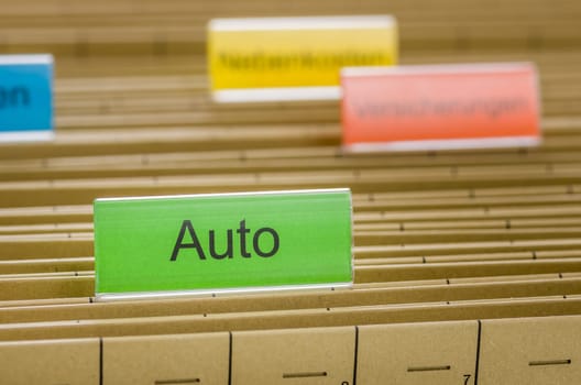 Hanging folders with the inscription Auto