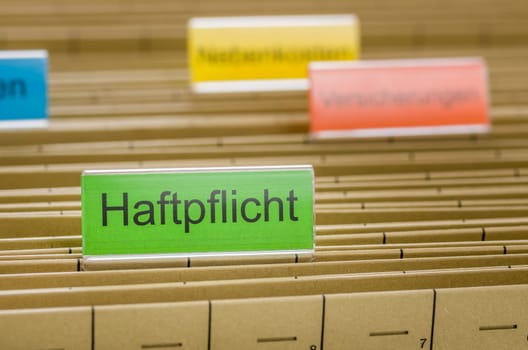 Hanging folders with the inscription Liability