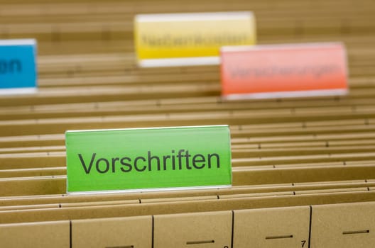 Hanging folders with the inscription Regulations