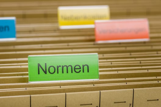 Hanging folders with the inscription Standards