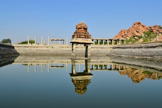 Ancient water pool and temple at Krishna market, Hampi, Karnataka state, India