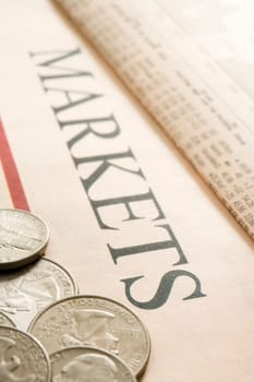 selection of american coins on paper marked Markets