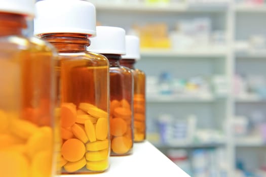 row of bottles and pills on a chemists counter