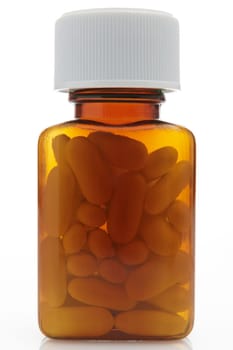 front on view of pills in a bottle on white background