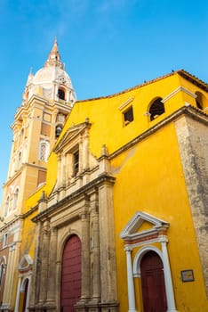 View of the colorful facade of the historic cathedral in Cartagena, Colombia