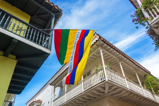 Colonial balconies with a Colombian flag in the historic center of Cartagena, Colombia