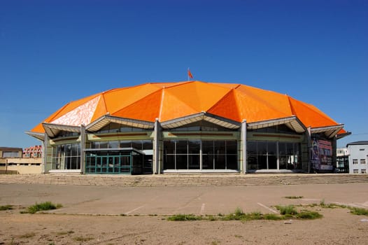 A building with an orange geodesic dome in Ulan Bator, Mongolia