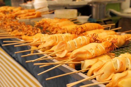 Thai style roasted stick on grill, typical street food in Thailand
