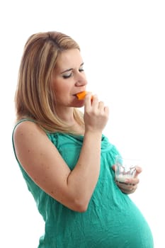 Details of a pregnant woman with a glass of milk and cheese isolated on white background.