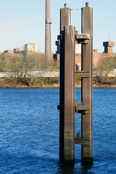 The photograph of an old industrial site,sewing machine factory in Wittenberge,with a pillar in the foreground.