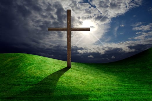 Christian cross of christ in field