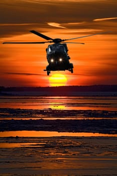 Helicopter at sunset