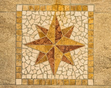 Wind rose made with ceramic pieces like a mosaic