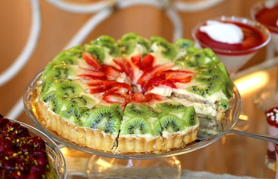 Fruit cake with strawberries and kiwi