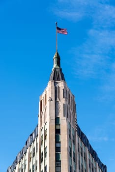 Old building flying an American flag in Chicago