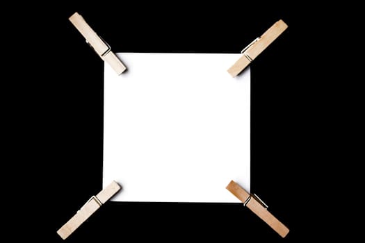 A reminder note pinned with a wooden peg on the side.