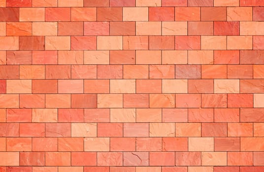 Surface of a terracotta colored wall.