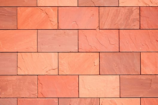 Surface of a terracotta colored wall.