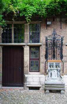 Water pump at the courtyard of the Rubenshouse, the former home and studio of Peter Paul Rubens in Antwerp, Belgium.