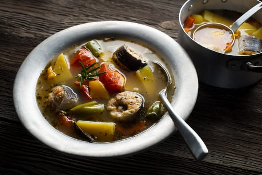 Healthy hot fish stew close up shoot