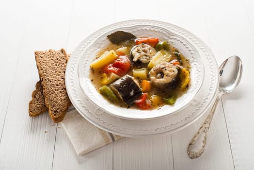 Healthy hot fish stew close up shoot
