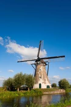 Dutch windmill at the river Vlist in the Netherlands.