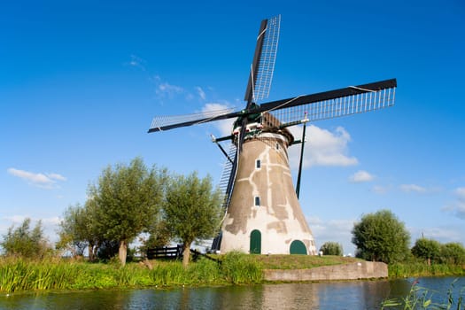 Dutch windmill at the river Vlist in the Netherlands.