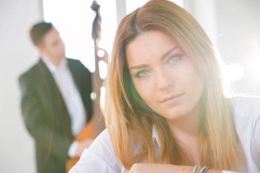 Zoomed face of young woman lighted by sun