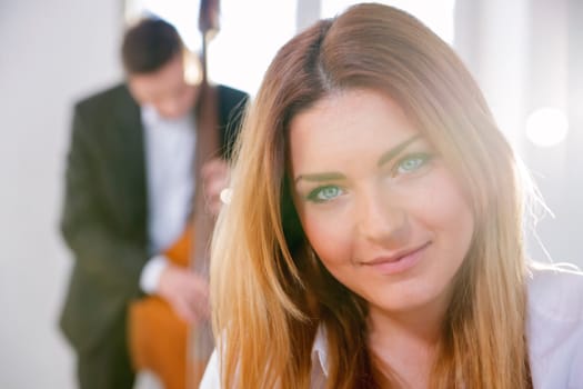 Zoomed face of smiling young woman on sunlight