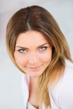 Portrait of  confident young woman in white suit