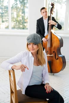 Charming woman at sunny day with grey hat