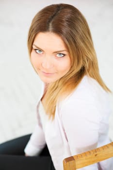 Charming woman in white suit with funny look