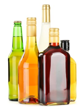 Bottles of assorted alcoholic beverages isolated on white background