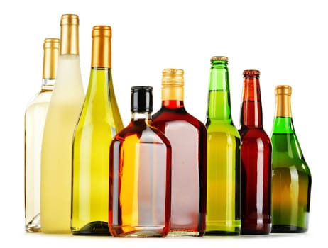 Bottles of assorted alcoholic beverages isolated on white background