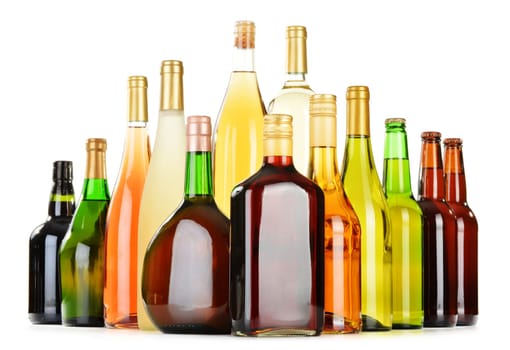 Bottles of assorted alcoholic beverages isolated on white background