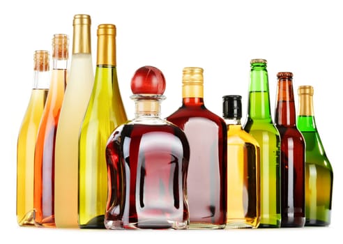 Bottles of assorted alcoholic beverages isolated on white background