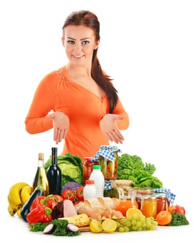 Young woman with assorted grocery products isolated on white background