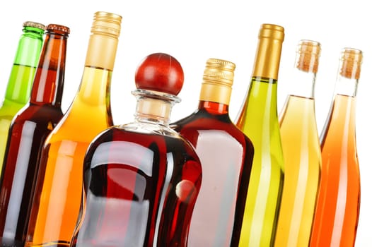 Bottles of assorted alcoholic beverages isolated on white background