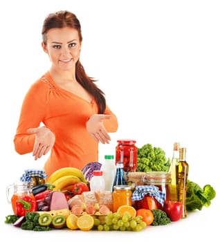 Young woman with assorted grocery products isolated on white background